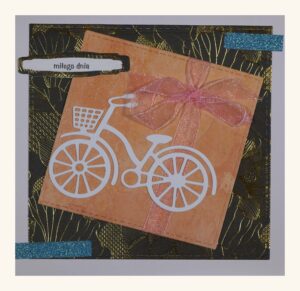 Ozdobna kartka, motywy: na środku rower, obok napis: „miłego dnia”.