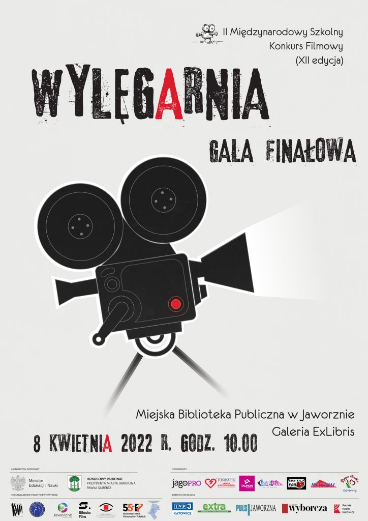Na ciemnoszarym tle widoczna duża, czarna kamera filmowa. Powyżej czarny napis: Wylegarnia. W prawym górnym rogu napis: II Międzynarodowy Szkolny Konkurs Filmowy (XII edycja). Poniżej tekst: Gala finałowa. W dolnym prawym rogu tekst: 8 kwietnia 2022 r., godz. 10.00. Miejska Biblioteka Publiczna w Jaworznie Galeria ExLibris. Poniżej belka z logotypami: Honorowy Patronat Ministra Edukacji i Nauki, Honorowy Patronat Prezydenta Miasta Jaworzna Pawła Silberta, logo Urzędu Miejskiego w Jaworznie; organizatorzy, partnerzy, patroni: logo Miejskiej Biblioteki Publicznej w Jaworznie, logo III Liceum Ogólnokształcącego im. Orła Białego w Jaworznie, logo Wydział Promocji, Kultury i Sportu Miasta Jaworzno, logo Instytucji Filmowej “Silesia Film”, logo Szkoły Filmowej im. Krzysztofa Kieślowskiego Uniwersytetu Śląskiego w Katowicach, logo Stowarzyszenie Filmowców Polskich, logo Kuratorium Oświaty w Katowicach; patroni medialni: logo Extra Jaworzno, logo PULS Jaworzna, logo Gazeta Wyborcza, logo Telewizja Katowice, logo Polskie Radio Katowice; sponsorzy: logo JagoPro, logo Fundacji Tauron, logo Fundacji Energetyka na Rzecz Polski Południowej, logo Fundacja „Energetyka na Rzecz Polski Południowej”, logo Auto Fan, logo Galeria Handlowa Galena, logo Fundacja TAURON, logo BETPOL.